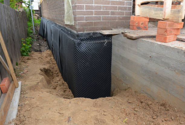 SJ Waterproofing Pros technician performing targeted Waterproofing assessment in Moline, IL